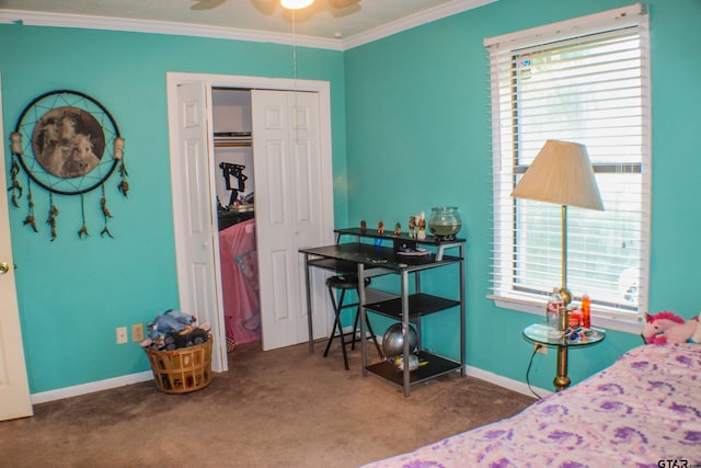 bedroom with a closet, carpet flooring, ceiling fan, and crown molding