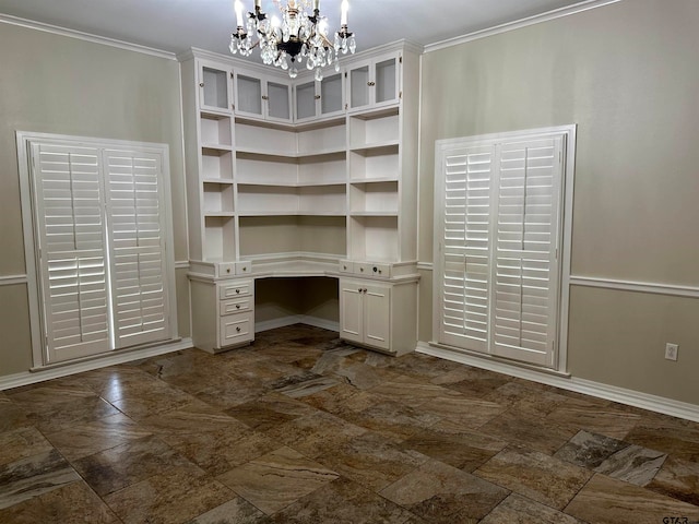 spacious closet with built in desk and a notable chandelier