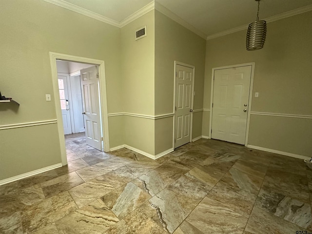 entryway featuring crown molding