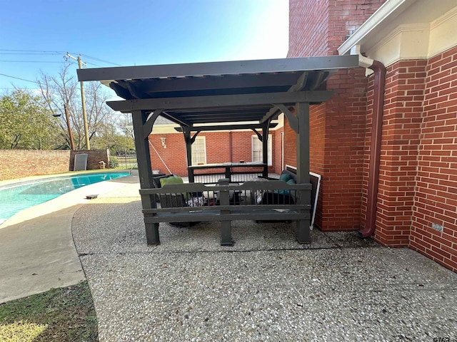 view of patio / terrace with a fenced in pool