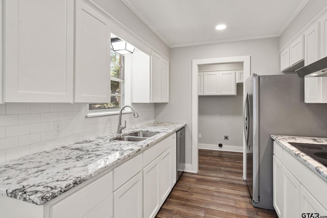 kitchen featuring sink, crown molding, dark wood-type flooring, white cabinets, and decorative backsplash