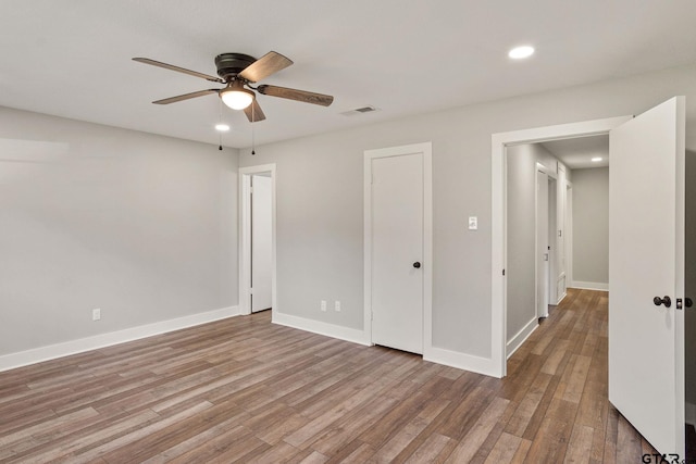 unfurnished bedroom featuring ceiling fan and light hardwood / wood-style flooring