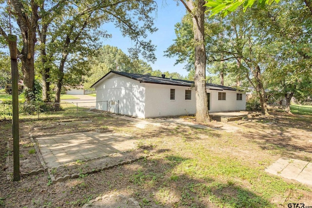 rear view of house featuring a patio