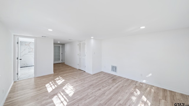 spare room featuring light hardwood / wood-style flooring