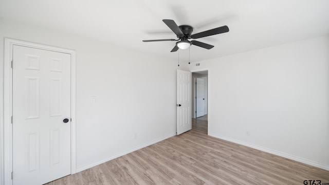 unfurnished room with ceiling fan and light hardwood / wood-style flooring