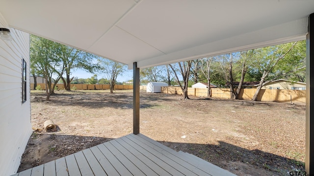 wooden deck with a storage unit