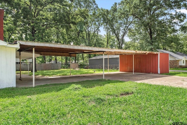 2002 Friendly Ave, Mount Pleasant, TX 75455 - view of vehicle parking featuring a carport and concrete driveway