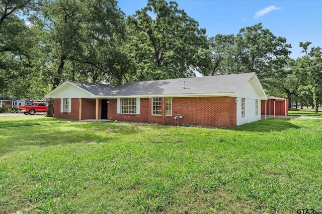 2002 Friendly Ave, Mount Pleasant, TX 75455 - view of front of home with a front lawn and brick siding
