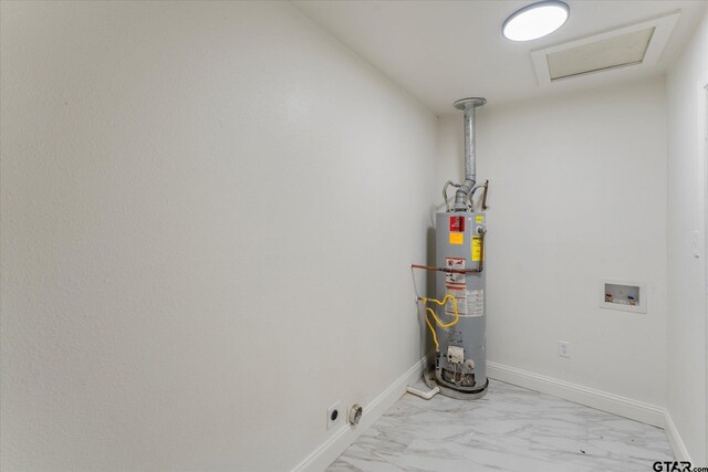 2002 Friendly Ave, Mount Pleasant, TX 75455 - utility room featuring water heater