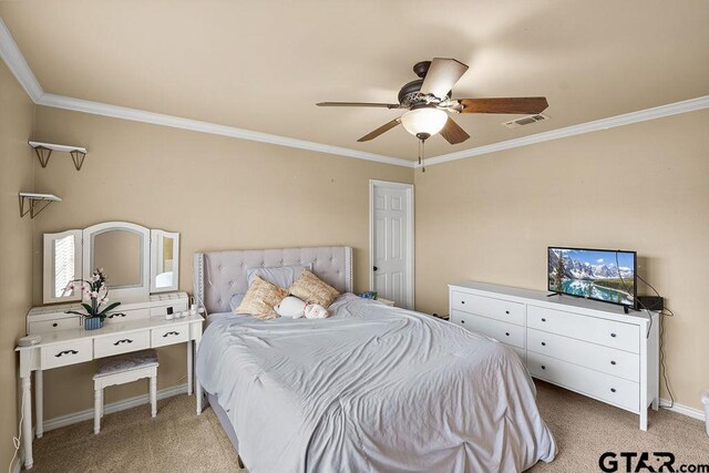 803 Marquette Ln, Tyler, TX 75703 - bedroom with light colored carpet, crown molding, ceiling fan, and baseboards