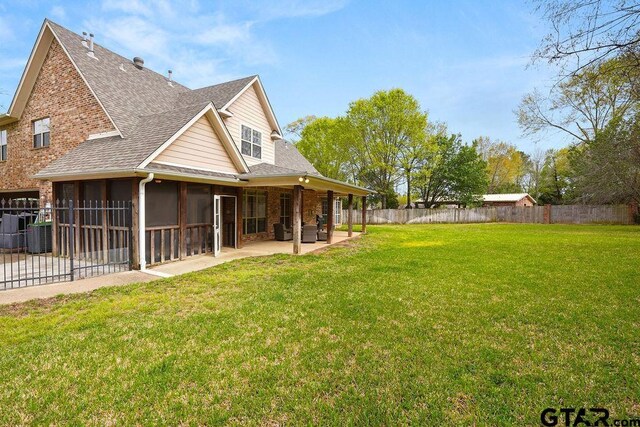 803 Marquette Ln, Tyler, TX 75703 - view of yard featuring a patio area and a sunroom