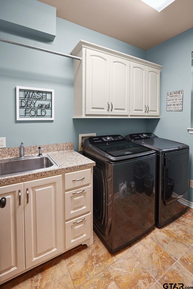 803 Marquette Ln, Tyler, TX 75703 - washroom featuring cabinet space, washer and dryer, and stone finish floors