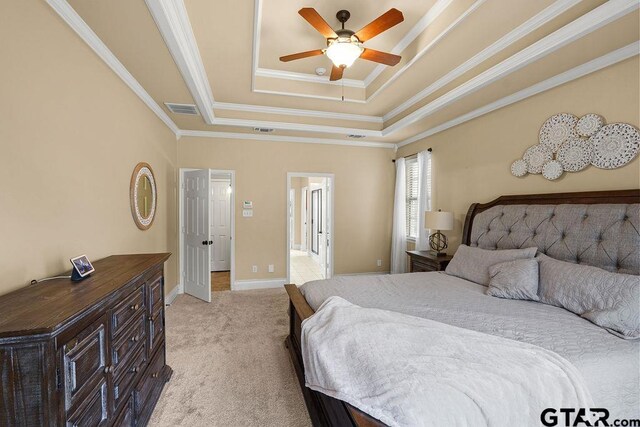 803 Marquette Ln, Tyler, TX 75703 - bedroom featuring a tray ceiling, light carpet, crown molding, baseboards, and ceiling fan