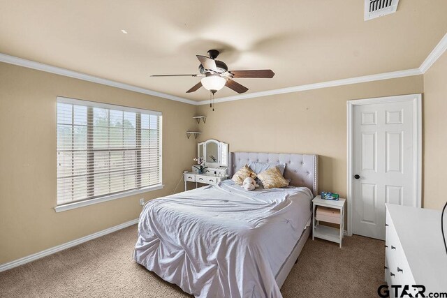 803 Marquette Ln, Tyler, TX 75703 - bedroom with carpet, ornamental molding, baseboards, and a ceiling fan