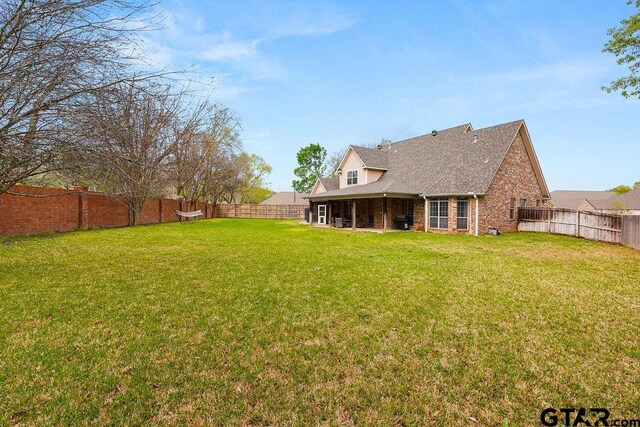 803 Marquette Ln, Tyler, TX 75703 - rear view of property featuring brick siding and a shingled roof