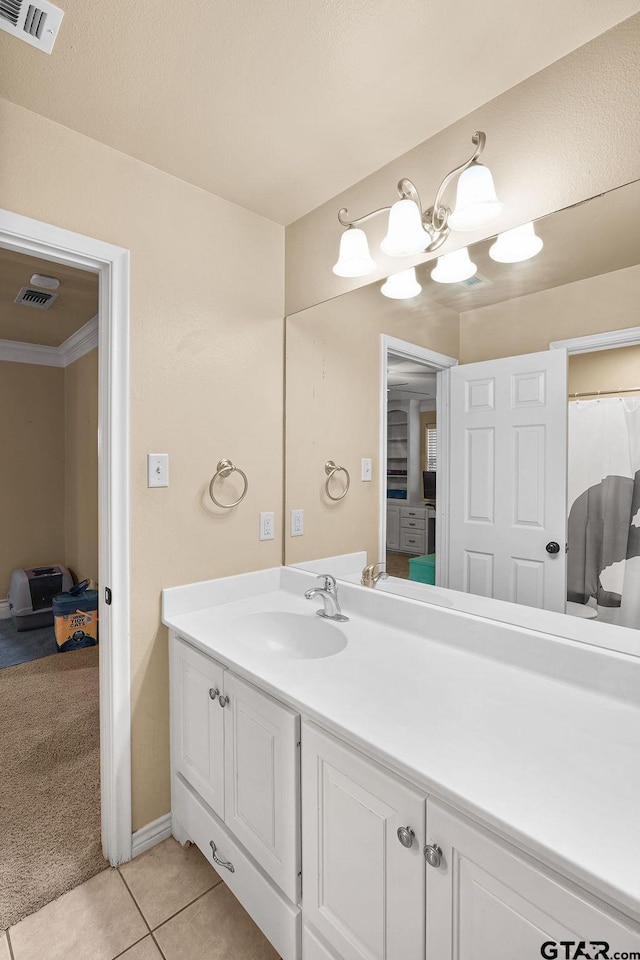 803 Marquette Ln, Tyler, TX 75703 - bathroom with vanity, tile patterned floors, a chandelier, and baseboards