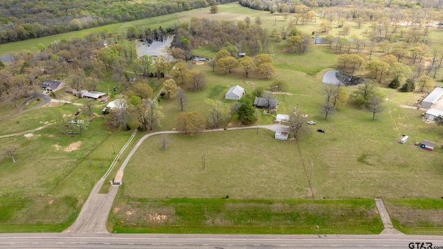 birds eye view of property with a rural view and a water view