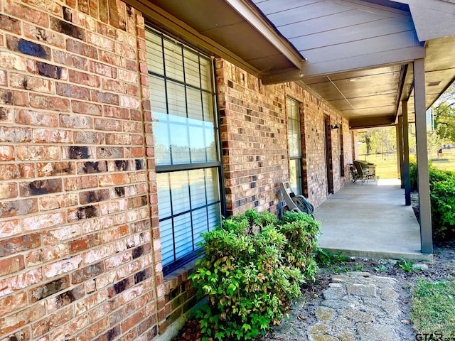 view of patio featuring a porch