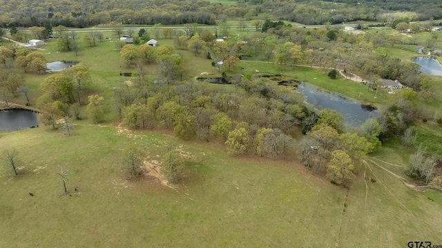 aerial view featuring a rural view and a water view