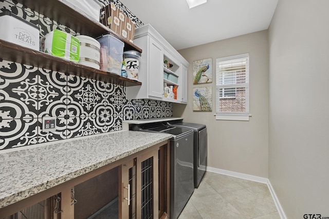 759 Hampton Hill Hill, Tyler, TX 75703 - washroom featuring independent washer and dryer, light tile patterned floors, and cabinet space