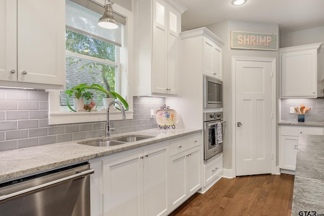 759 Hampton Hill Hill, Tyler, TX 75703 - kitchen with stainless steel appliances, tasteful backsplash, white cabinets, dark wood-style floors, and light stone counters