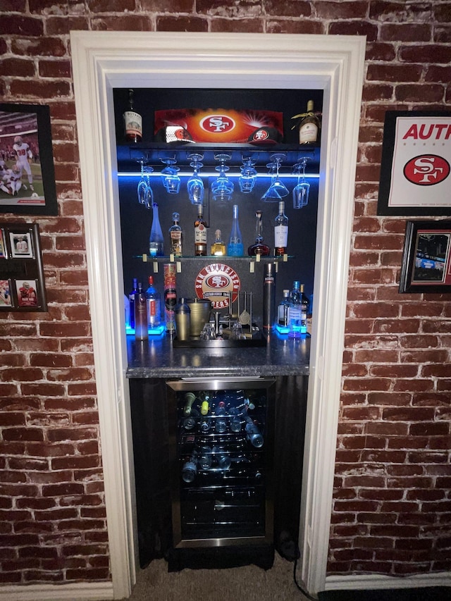 214 Rosebrook Cir, Whitehouse, TX 75791 - indoor dry bar featuring brick wall and wine cooler