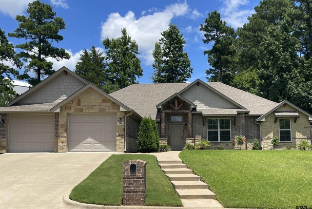 214 Rosebrook Cir, Whitehouse, TX 75791 - view of front of property with stone siding, an attached garage, a front yard, driveway, and roof with shingles
