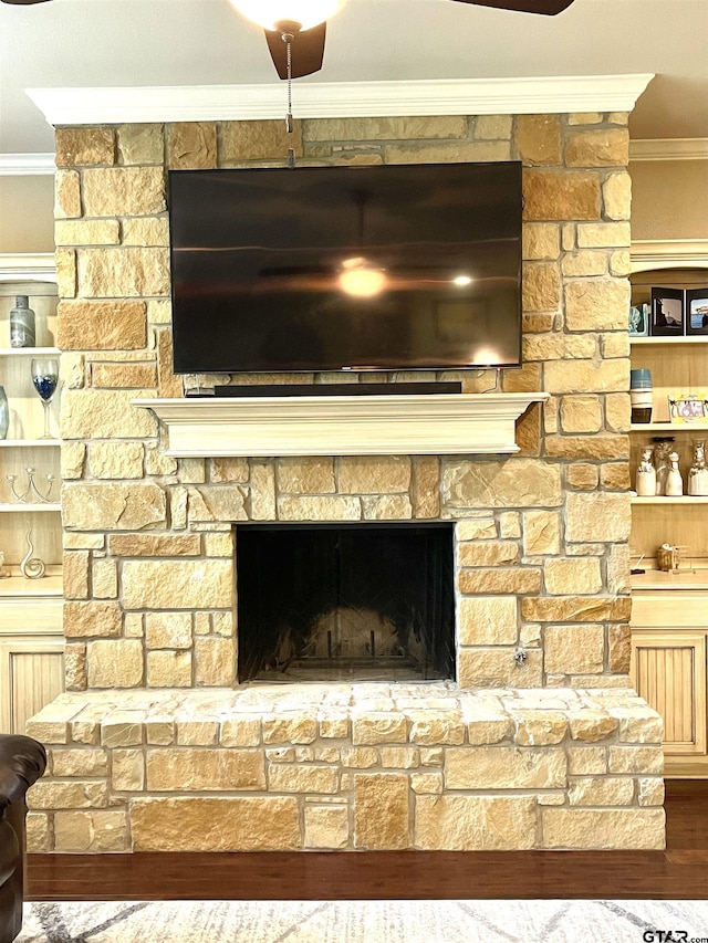 214 Rosebrook Cir, Whitehouse, TX 75791 - detailed view of crown molding, a stone fireplace, and wood finished floors