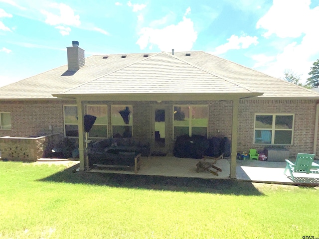 214 Rosebrook Cir, Whitehouse, TX 75791 - back of property with brick siding, a patio area, a chimney, and a yard