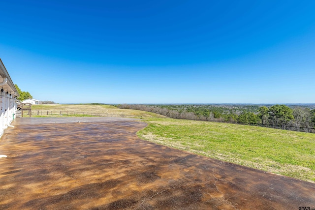 view of yard with a rural view