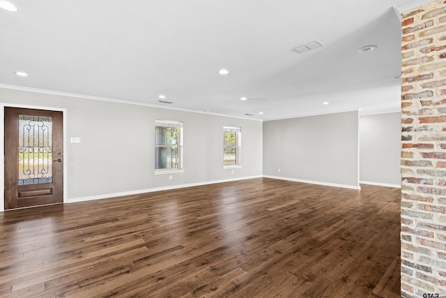 unfurnished living room with dark hardwood / wood-style floors and crown molding