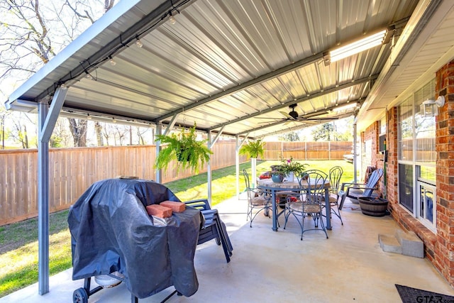 2505 W Gay Ave, Gladewater, TX 75647 - view of patio featuring outdoor dining space, ceiling fan, and grilling area