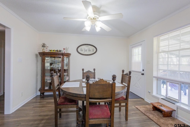 2505 W Gay Ave, Gladewater, TX 75647 - dining room featuring wood finished floors, a ceiling fan, ornamental molding, and baseboards