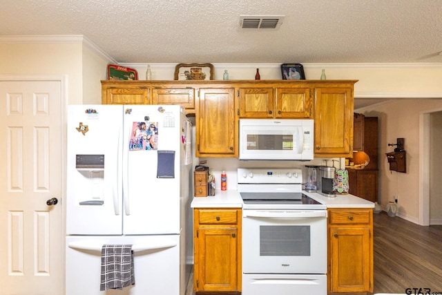 2505 W Gay Ave, Gladewater, TX 75647 - kitchen with white appliances, a textured ceiling, light countertops, dark wood finished floors, and ornamental molding