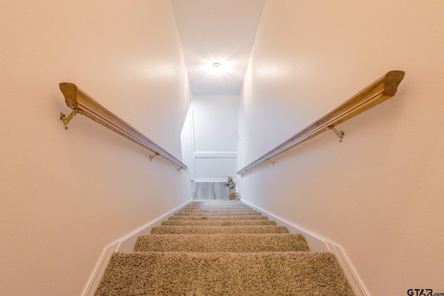 2505 W Gay Ave, Gladewater, TX 75647 - stairway featuring baseboards