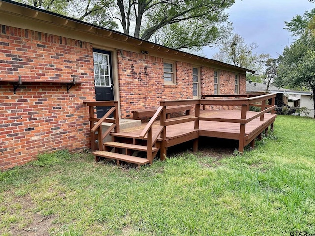 wooden terrace with a lawn