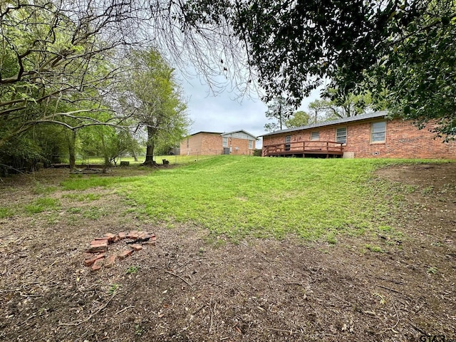 view of yard with a wooden deck