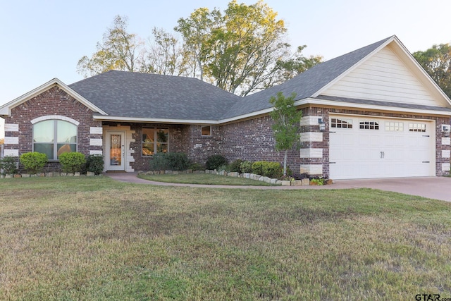 view of front of home featuring a front lawn and a garage