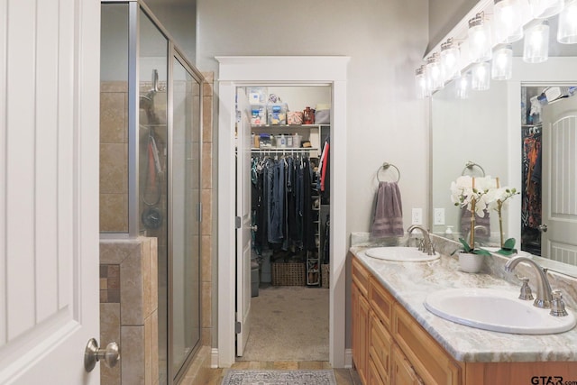 bathroom with vanity and an enclosed shower