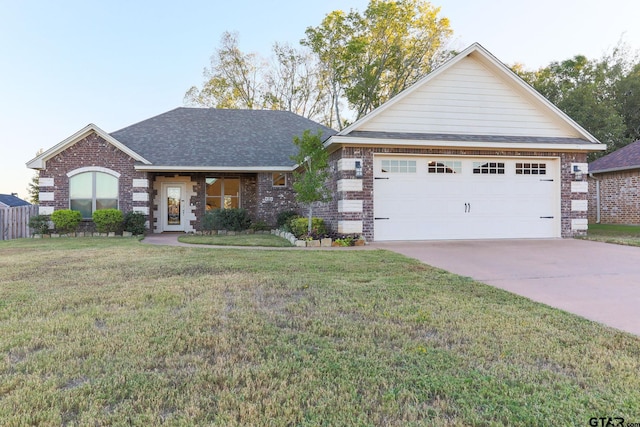 view of front of house featuring a garage and a front lawn