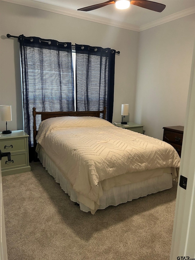 bedroom featuring light colored carpet, ceiling fan, and crown molding