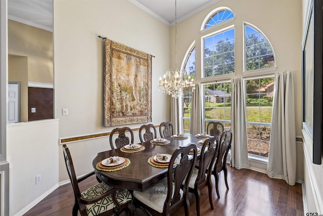 1737 Bearwood Ln, Tyler, TX 75703 - dining area featuring wood finished floors, crown molding, a chandelier, baseboards, and a towering ceiling