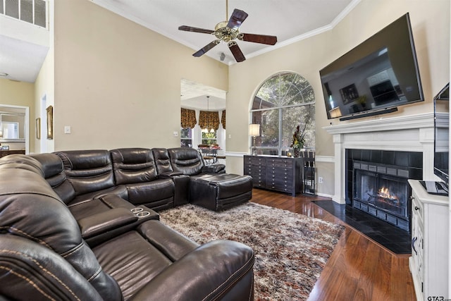 1737 Bearwood Ln, Tyler, TX 75703 - living area with hardwood / wood-style floors, ceiling fan, a tile fireplace, and crown molding