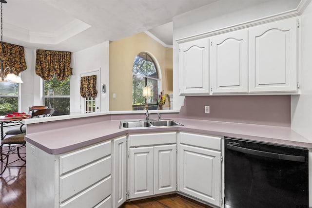 1737 Bearwood Ln, Tyler, TX 75703 - kitchen featuring black dishwasher, a peninsula, ornamental molding, dark wood finished floors, and white cabinets
