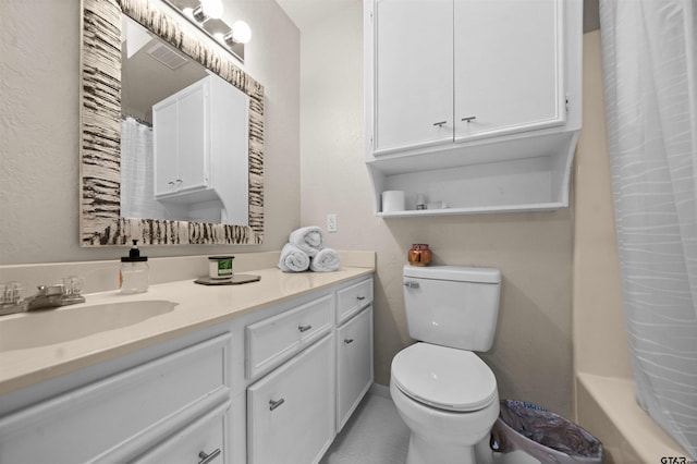 full bathroom featuring toilet, shower / bath combo, vanity, and tile patterned flooring