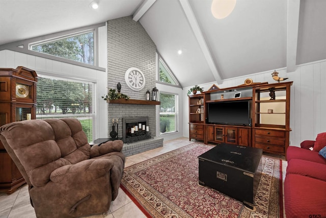 living room featuring a brick fireplace, a healthy amount of sunlight, beam ceiling, and light tile patterned flooring