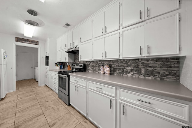 kitchen with white cabinetry, white refrigerator, backsplash, and electric range