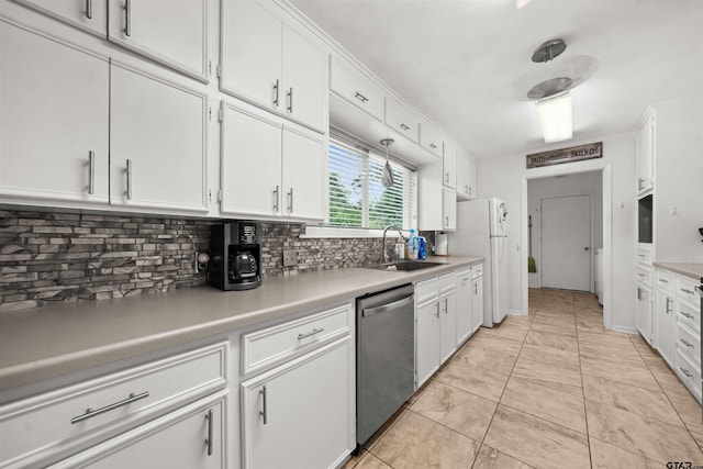 kitchen featuring white fridge, white cabinetry, backsplash, sink, and dishwasher