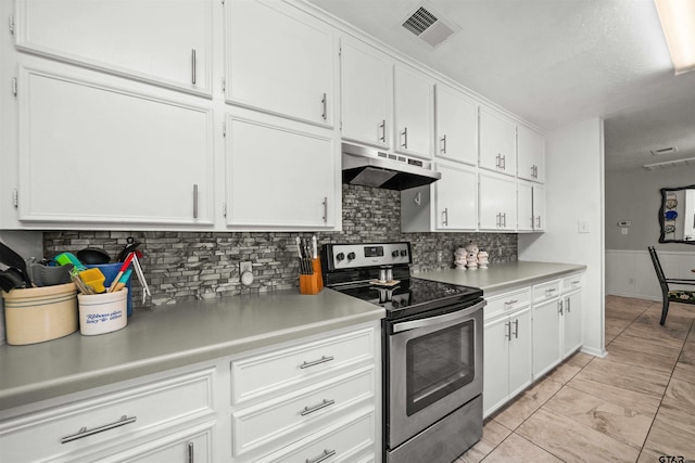 kitchen featuring white cabinetry, stainless steel electric range, and backsplash