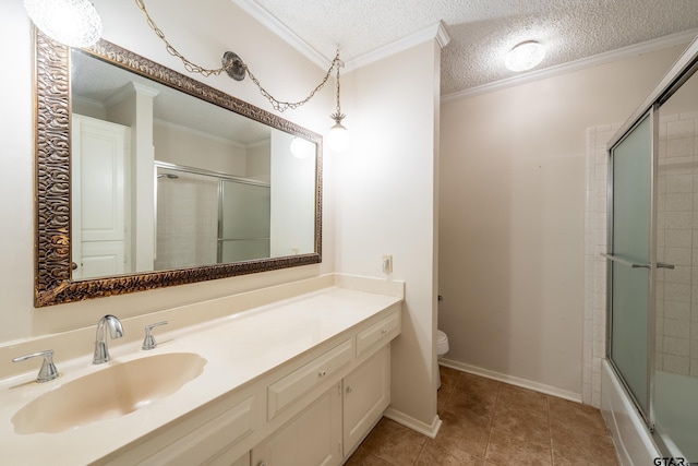 bathroom with a textured ceiling, ornamental molding, and toilet